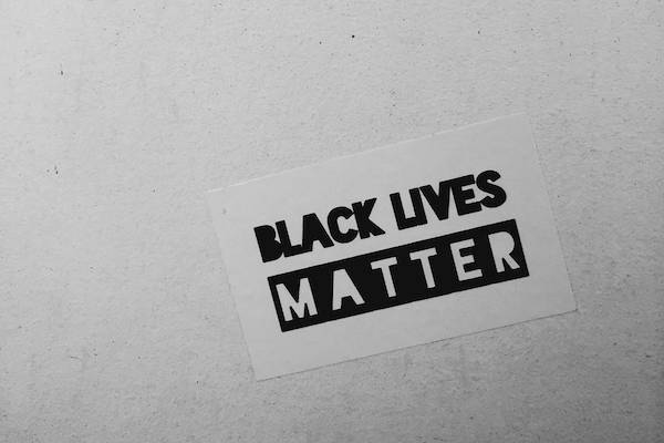 Black lives matter sticker on a wall